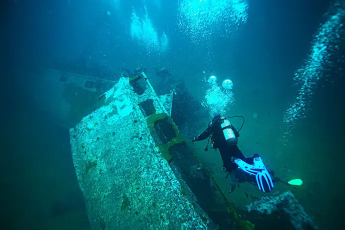 Diver exploring shipwreck